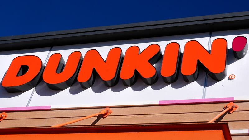 FILE -- The Dunkin' name appears on a sign over the doorway at a location in New Hampshire....