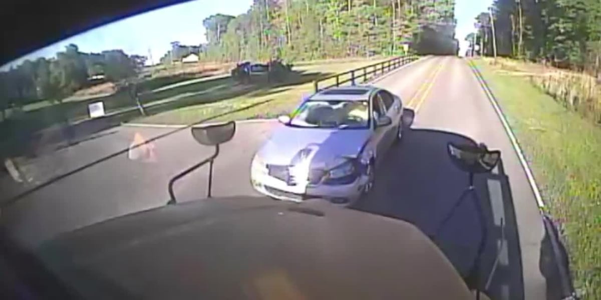 Driver seen hitting school bus head-on seconds after students cross street