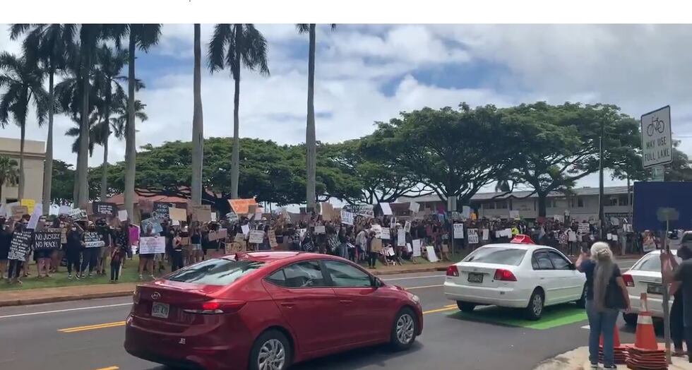 On Kauai, a crowd gathered on the lawn of the County Building.