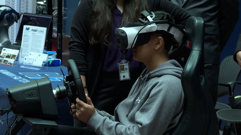 A child trying a virtual reality demonstration at the U.S. Department of Transportation's...