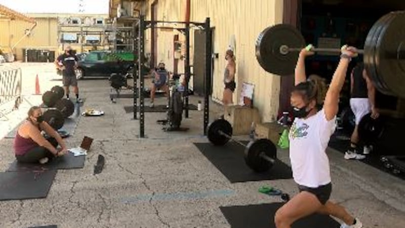 At CrossFit 808 in Kalihi, equipment like rowing machines, exercise bikes, and barbells have...