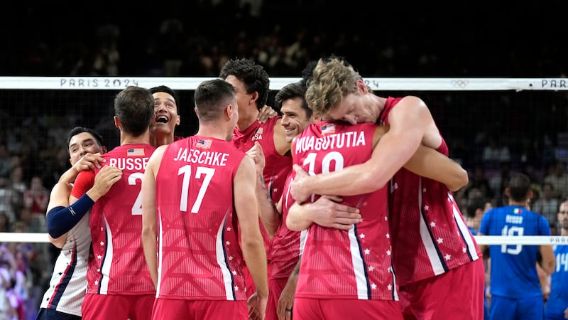 Unites States players celebrate after winning a men's volleyball bronze medal match against...