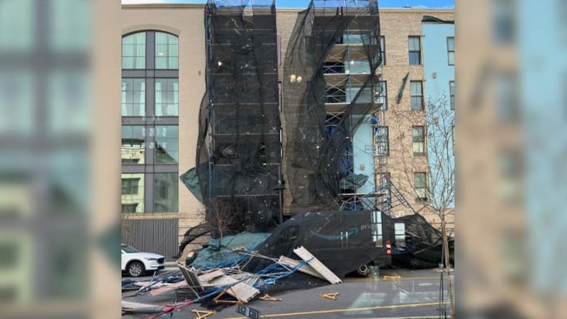 A scaffolding collapsed Monday during high winds outside a Sotille Street apartment building...