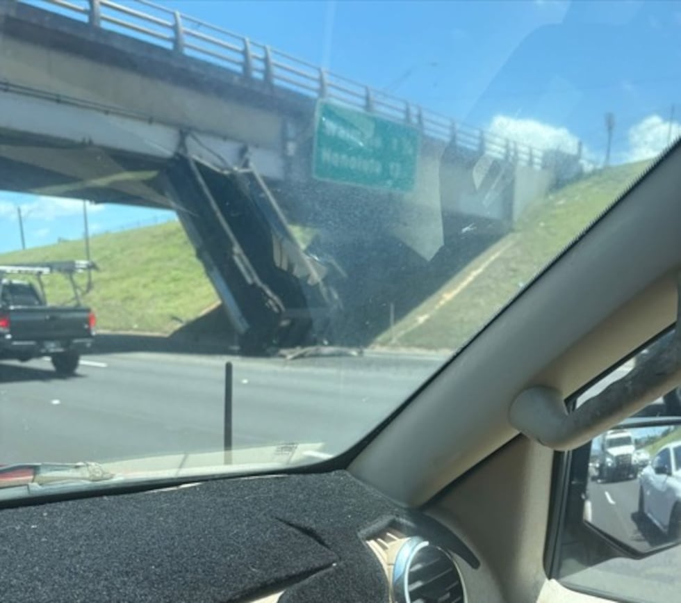 According to viewers at the scene, a semi-trailer struck the overpass, detaching the trailer...