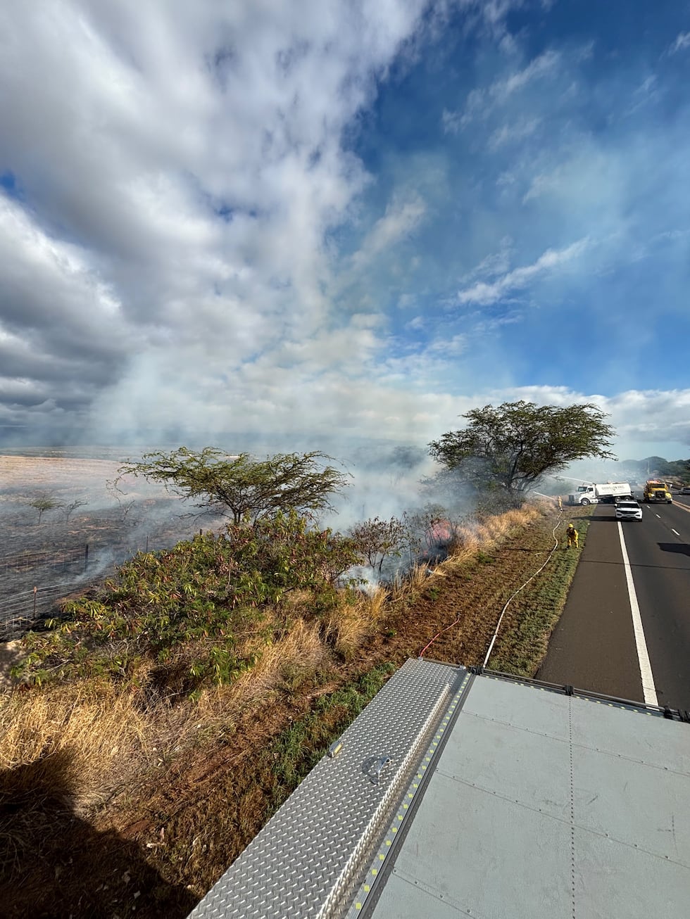Firefighters on Maui contained a brush fire that burned along Piilani Highway in Kihei Monday...