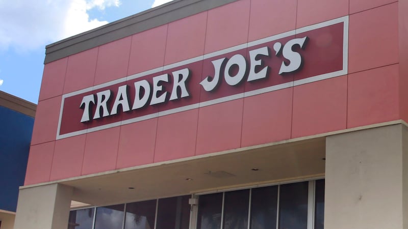 FILE - People stand in line waiting to enter Trader Joe's to buy groceries in Pembroke Pines,...