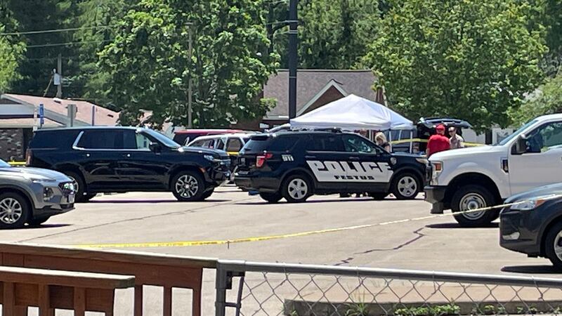Investigators outside the Festus Police Department after a child was found fatally shot inside...