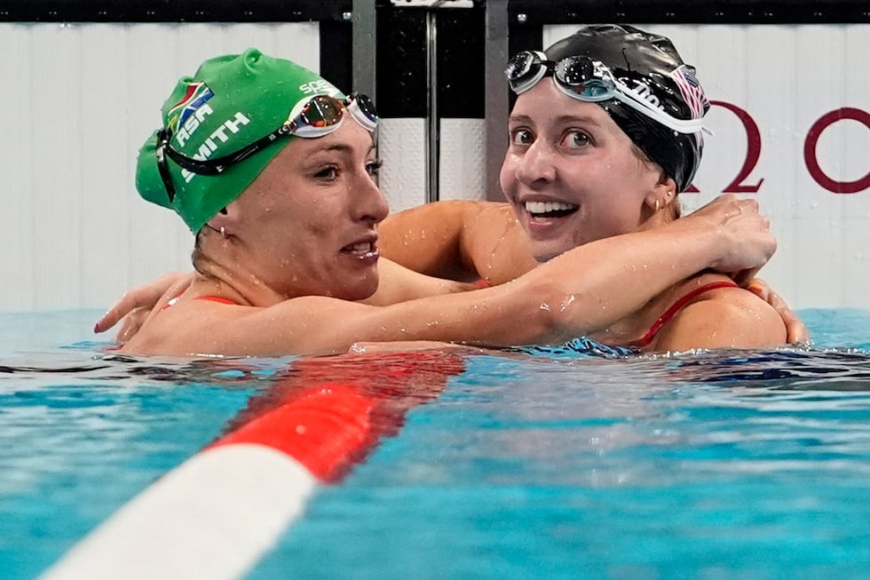 Kate Douglass, right, of the United States, is congratulated by Tatjana Smith, of South...