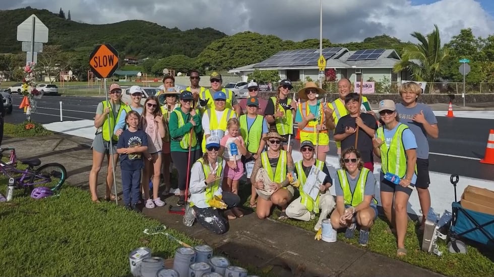More than 70 volunteers came out to brighten Keolu Drive in hopes that cars would slow down.
