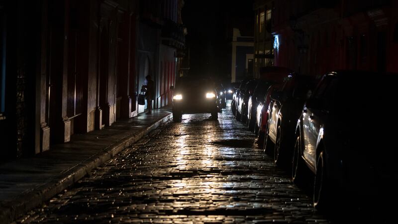 Headlights illuminate cobblestone streets in Old San Juan, Puerto Rico, during an island-wide...