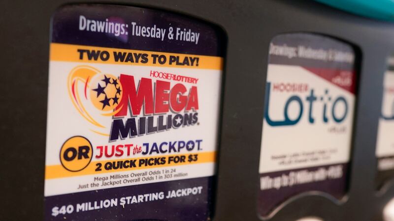 FILE - A Mega Millions logo is displayed on a vending machine at the Hoosier Lottery booth at...
