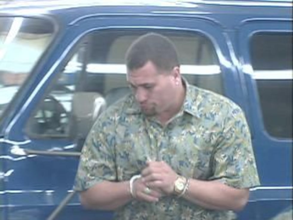 Rodney Joseph as he was being brought into police headquarters for booking.