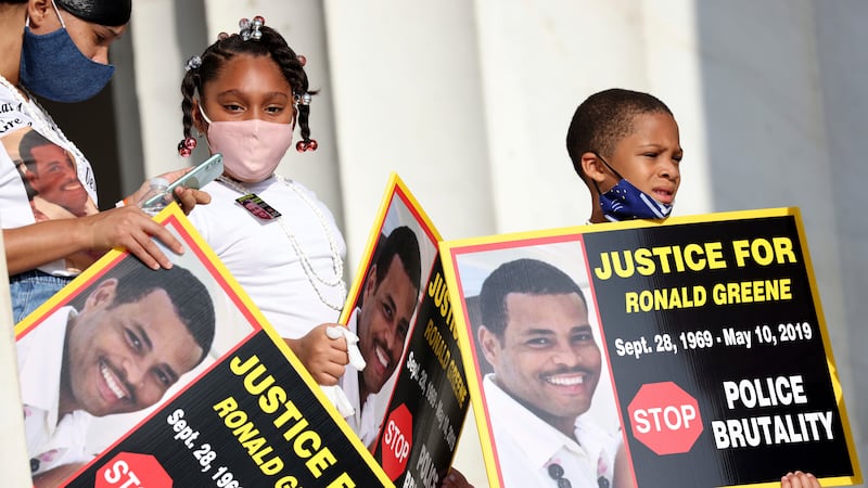 FILE - Family members of Ronald Greene listen to speakers as demonstrators gather for the...