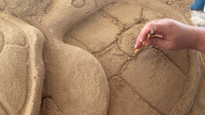 He works alone and every piece requires a lot of stacking and packing of sand. One sculpture...