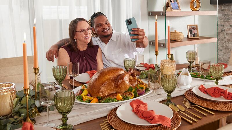 FILE - An accidental Thanksgiving invitation text has led to some incredible memories for...