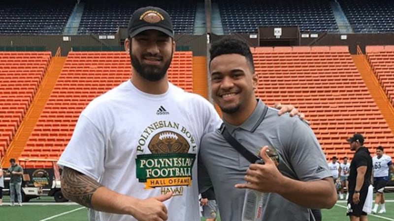 Iowa defensive end AJ Epenesa and Alabama quarterback Tua Tagovailoa served as honorary...