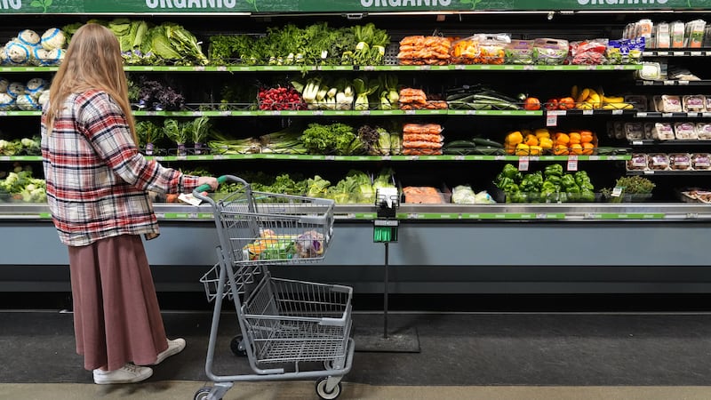 A person shops for produce, which is covered by the USDA Supplemental Nutrition Assistance...