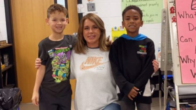 Mrs. Rachel Duncan-Anderson with students Major Loggins and Logan Bingham.