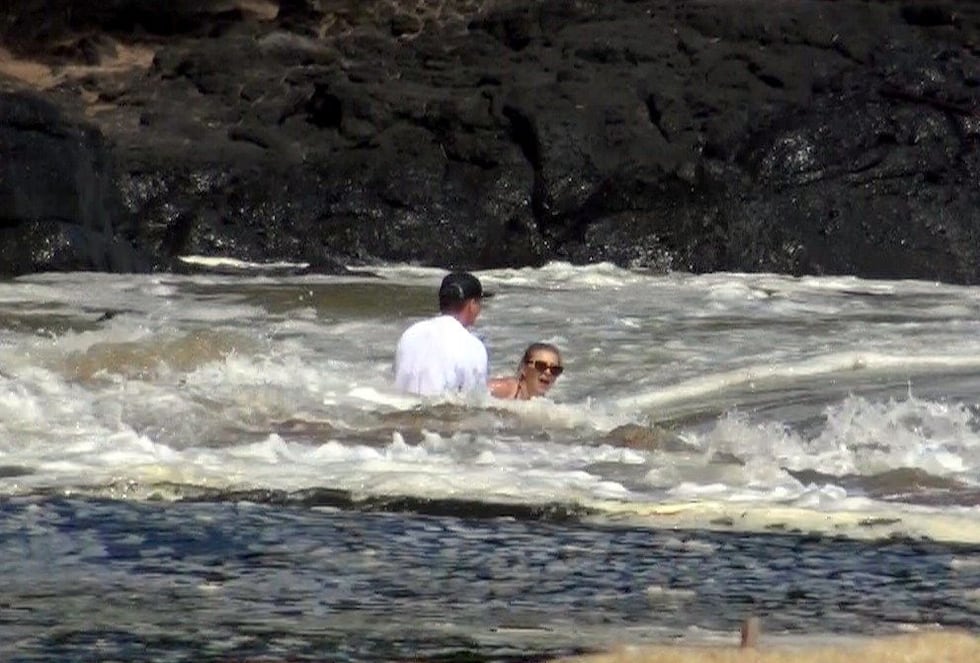 Beachgoers wading at Lumahai Beach on Kauai got swept into the waves repeatedly in Tuesday's...