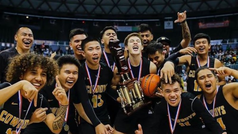 Kohala Cowboys celebrate after defeating Roosevelt 51-48 in Friday night's Division II state...
