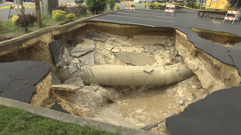 A sinkhole in the parking lot of a Vitamin Shoppe in the Gaitway Plaza caused the store to...