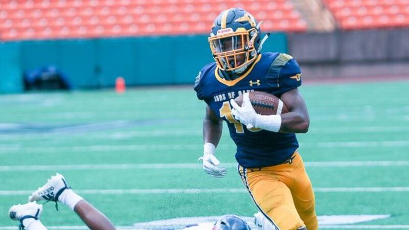 Punahou running back Vincent Terrell eludes Waianae defender