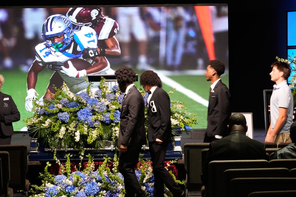 People line up for a viewing during a memorial service for Nolan Xavier Wells, an 18-year-old...