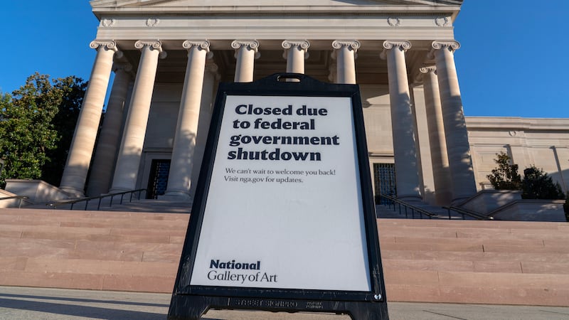 A sign that reads "Closed due to federal government shutdown," is seen outside of the National...