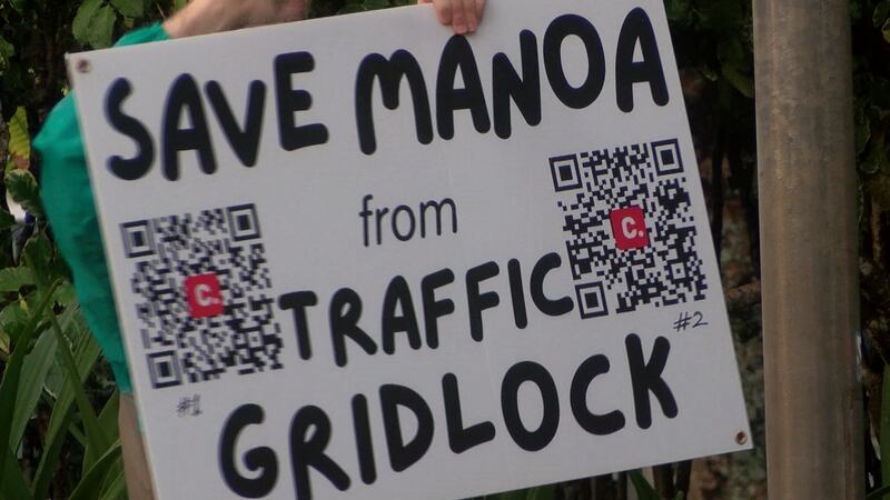 A group of Manoa residents held a street corner sign-waving against a proposed residential...