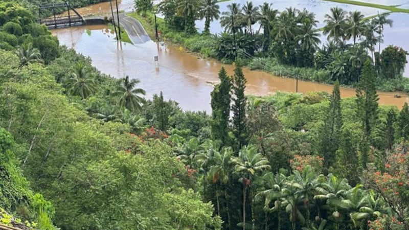 Heavy rain sent floodwaters down the Hanalei River, forcing the closure of Kuhio Highway at...