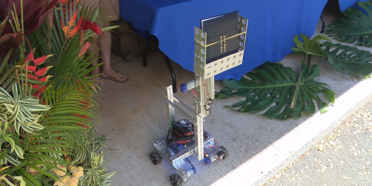 First Robotics Graduation Table A graduation to remember: Robot hands out diplomas to Assets seniors