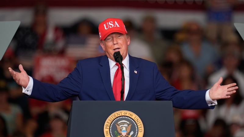 President Donald Trump speaks at a campaign rally at Dalton Municipal Airport, Friday, Oct....