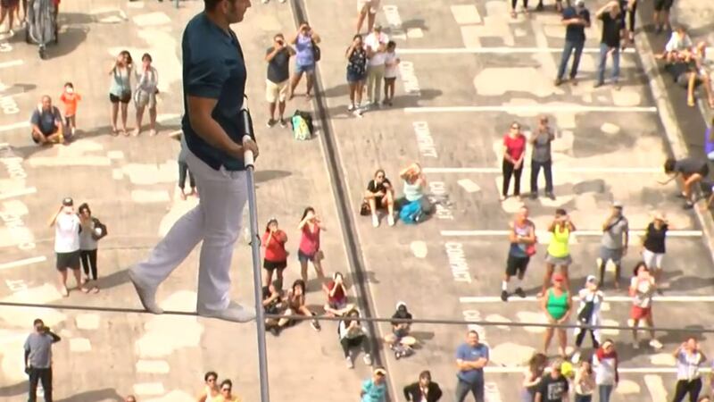 Daredevil Blake Wallenda walks on a highwire between two Ala Moana towers.