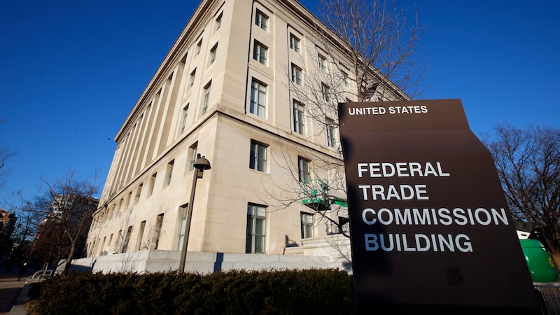 FILE - A sign stands outside the Federal Trade Commission building, Jan. 28, 2015, in...
