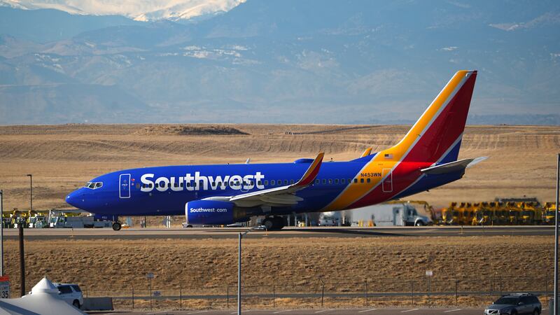 Southwest Airlines jetliner taxis down a runway for take off at Denver International Airport,...