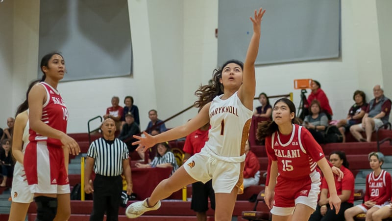 Spartans Kira Kaopua attempts layoff in second half against Kalani on Monday night