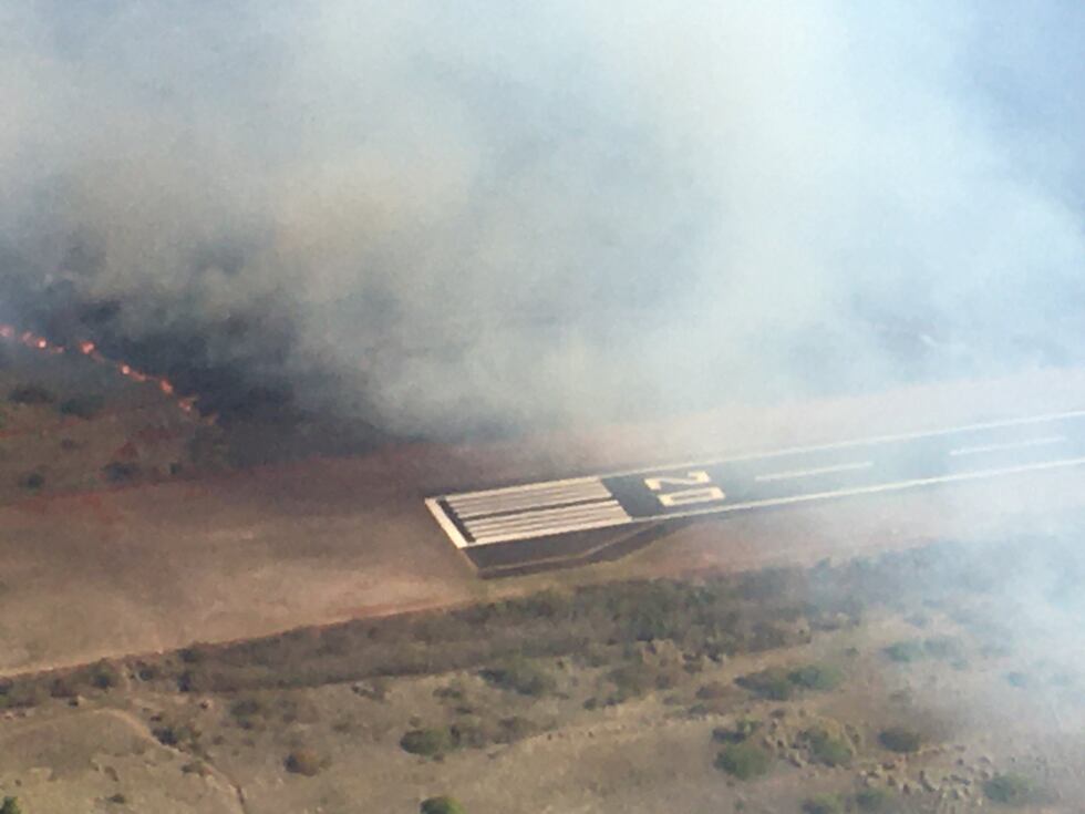 Flames jumped the runway at Kapalua Airport on Tuesday afternoon.