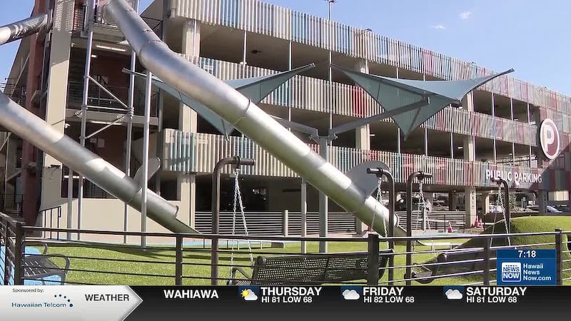 A new public park opened recently in the plaza that features two huge slides connected to the...