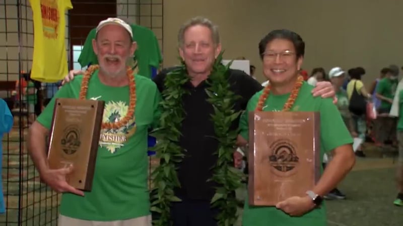 Jerold Chun and Gary Dill is honored for running the Honolulu Marathon over 50 times.